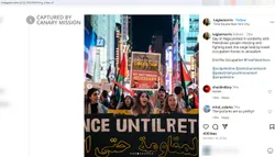 Alwan marches at a WOL protest holding a sign calling for Palestinian “liberation by any means necessary”—a phrase used to justify terror.